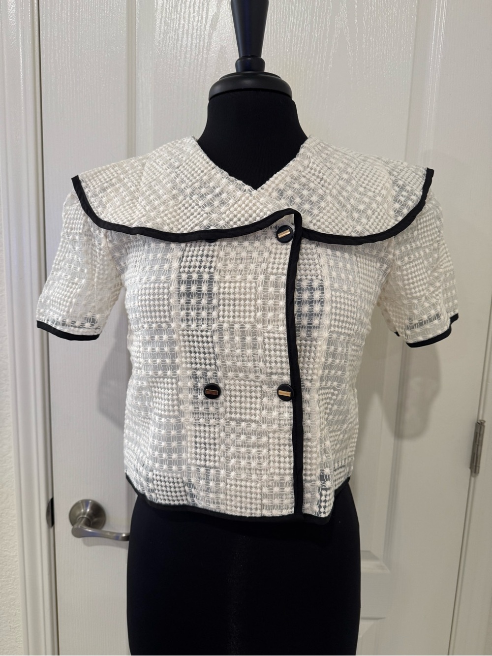 White Textured Short-Sleeve Blouse with Black Trim